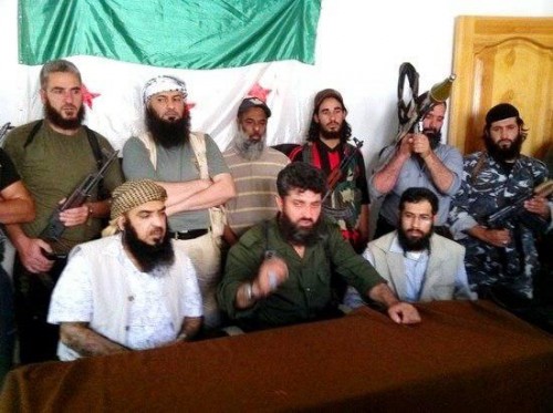 Four leaders from Al-Asala Society among a group of extremist militants in Syria